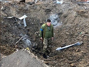 Funnel from a fallen shell in Kyiv